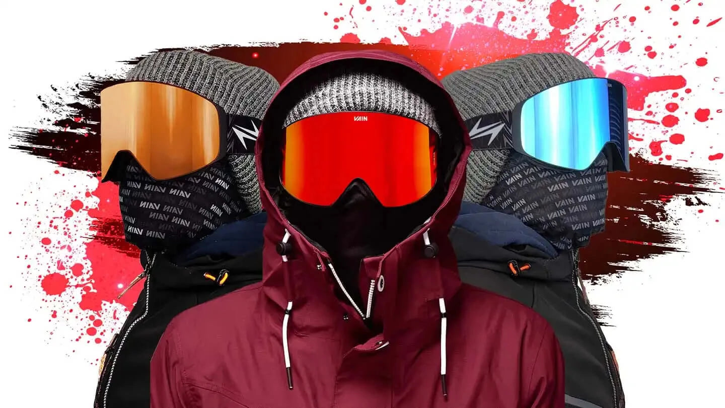 Image of three people with ski goggles on