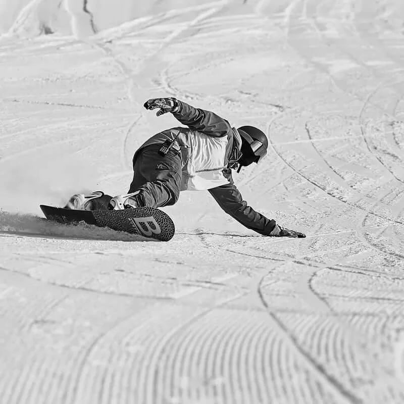 Snowboarder on steep slopes